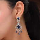 Rhodium Plated Silver Toned Teardrop Shaped Blue & White American Diamond Studded Earrings
