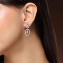 Rhodium Plated Silver Toned Floral Oval Shaped Pink & White American Diamond Studded Drop Earrings