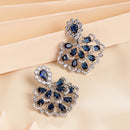 Rhodium Plated Silver Toned Petal Cluster Blue & White American Diamond Studded Earrings