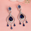 Rhodium Plated Silver Toned Teardrop Shaped Blue & White American Diamond Studded Earrings