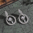 Rhodium-Plated Grey & White American Diamond studded Oval Shaped Drop Earrings