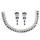 Rhodium Plated Silver Toned Blue American Diamond  Studded Classic Necklace With Floral Drop Earrings