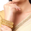 Set Of 4 Gold-Toned Textured Bangles