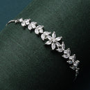 Rhodium Plated Silver Toned White Floral Shaped American Diamond Studded  Bracelet