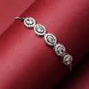 Rhodium-Plated Silver Toned Oval Shaped White American Diamond Studded Bracelet