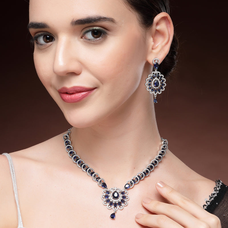 Rhodium Plated Silver Toned Ornate Shaped Navy Blue & White American Diamond Studded Jewellery Set