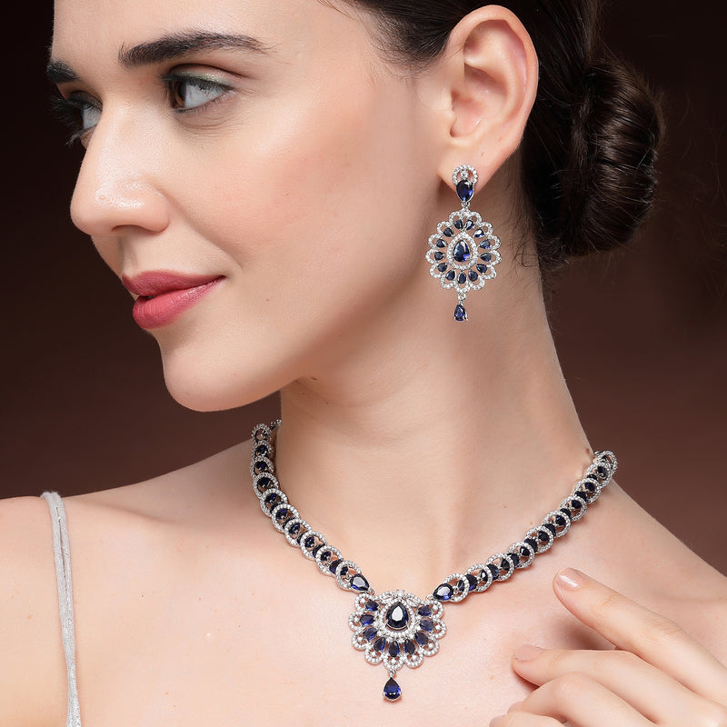 Rhodium Plated Silver Toned Ornate Shaped Navy Blue & White American Diamond Studded Jewellery Set
