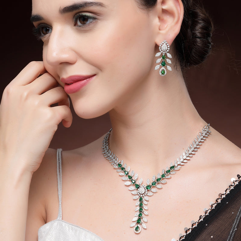 Rhodium Plated Silver Toned Leaf Shaped Green & White American Diamond Studded Necklace With Earrings Jewellery Set