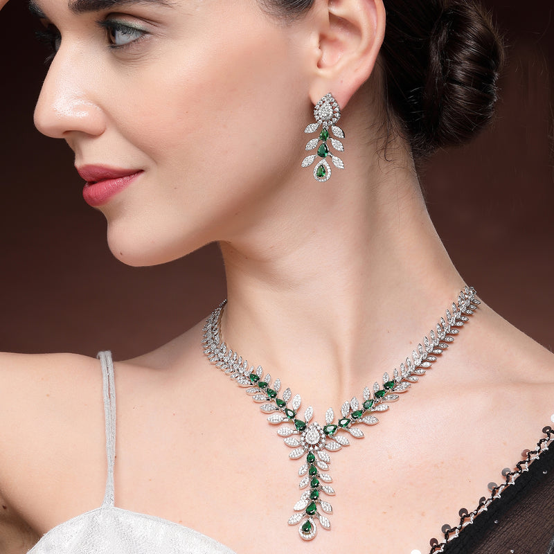 Rhodium Plated Silver Toned Leaf Shaped Green & White American Diamond Studded Necklace With Earrings Jewellery Set