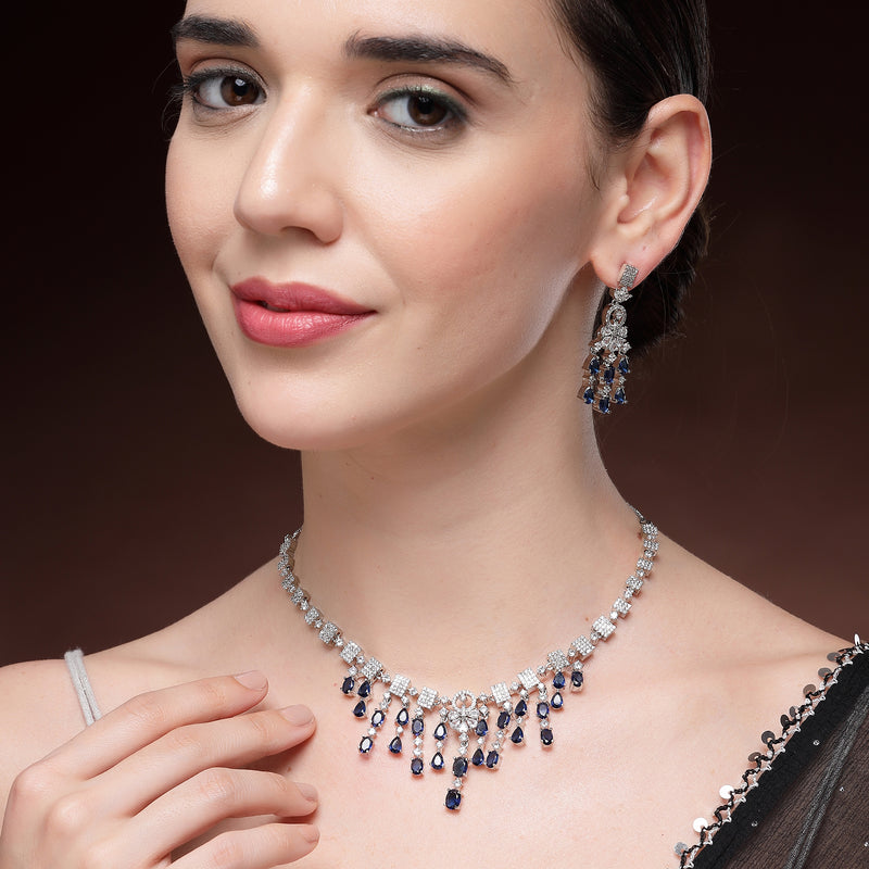 Rhodium Plated Silver Toned Teardrop Shaped Blue & White American Diamond Studded Jewellery Set