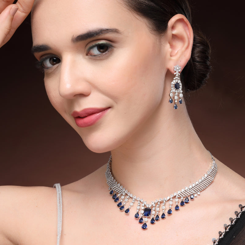 Rhodium Plated Silver Toned Teardrop Shaped Blue & White American Diamond Studded Jewellery Set