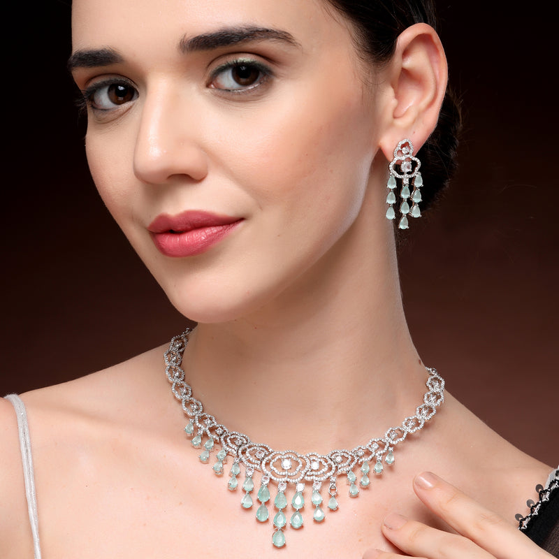 Rhodium Plated Silver Toned Floral Sea Green & White American Diamond Studded Jewellery Set