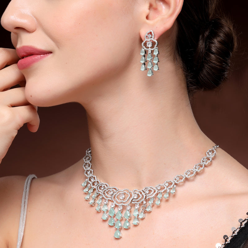 Rhodium Plated Silver Toned Floral Sea Green & White American Diamond Studded Jewellery Set