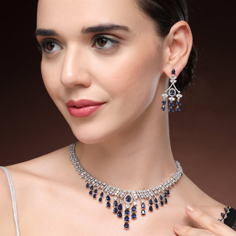 Rhodium Plated Silver Toned Teardrop Shaped Blue & White American Diamond Studded Jewellery Set