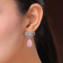 Rhodium Plated Silver Toned Bow Shaped Pink & White American Diamond Studded Drop Earrings