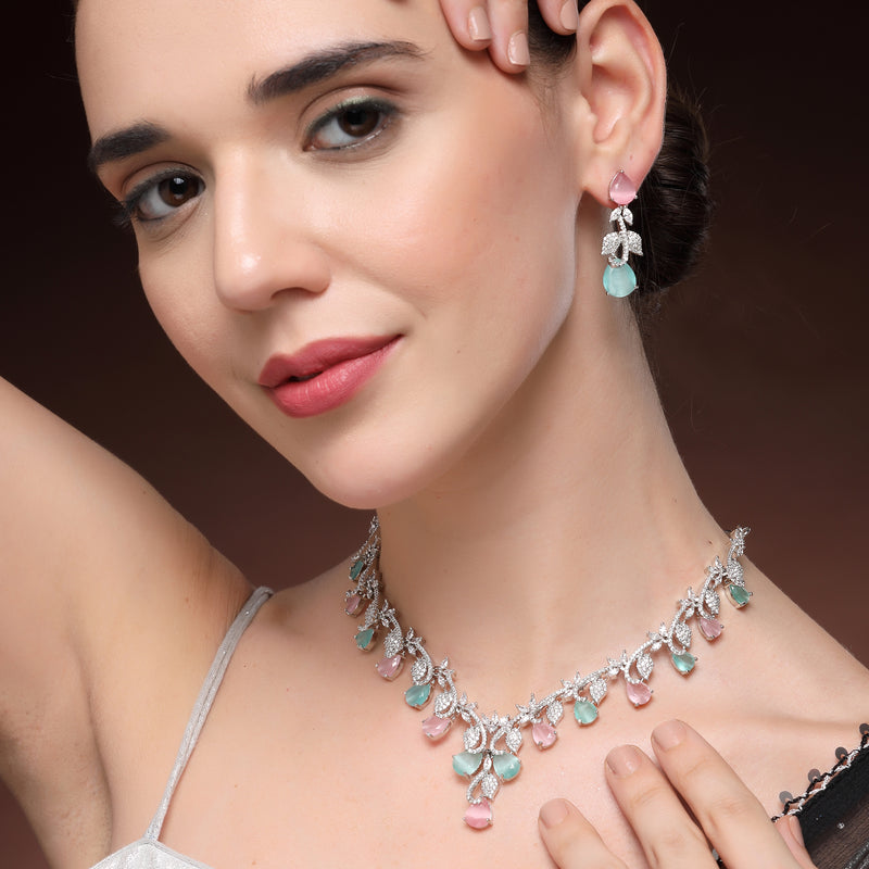 Rhodium Plated Silver Toned Leaf Teardrop Shaped Pink & Sea Green American Diamond Studded Jewellery Set