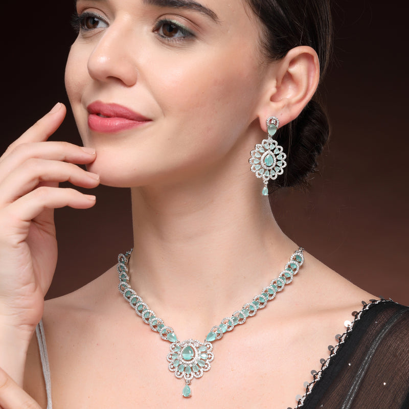 Rhodium Plated Silver Toned Ornate Shaped Sea Green & White American Diamond Studded Jewellery Set