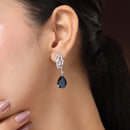Rhodium Plated Silver Toned Teardrop Shaped Navy Blue & White American Diamond Studded Drop Earrings