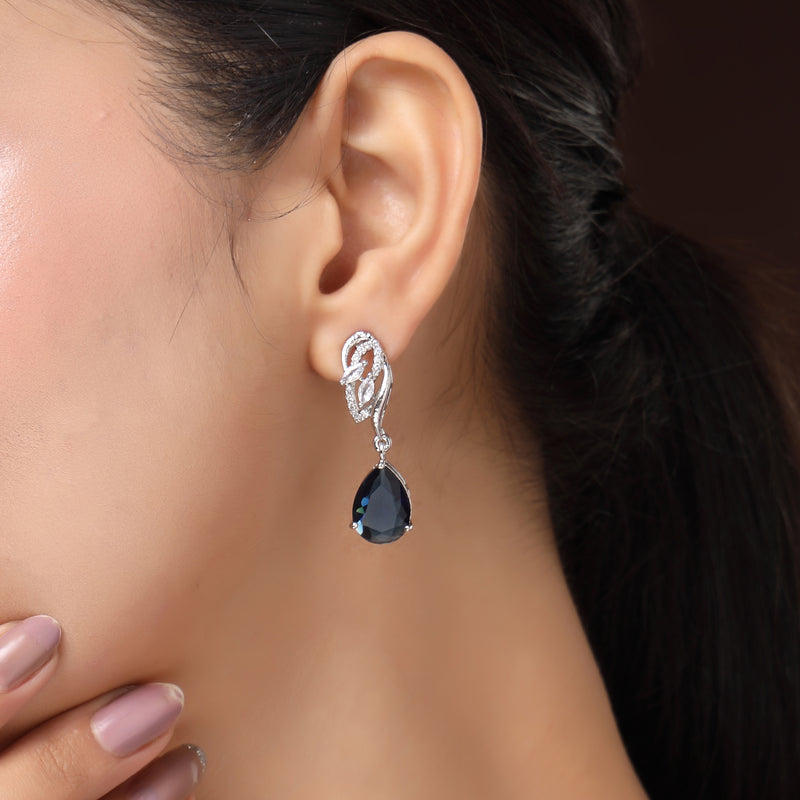 Rhodium Plated Silver Toned Teardrop Shaped Navy Blue & White American Diamond Studded Drop Earrings