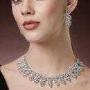 Rhodium Plated Silver Toned Halo Teardrop Design With White Square American Diamond Studded  Necklace With Matching Drop Earrings