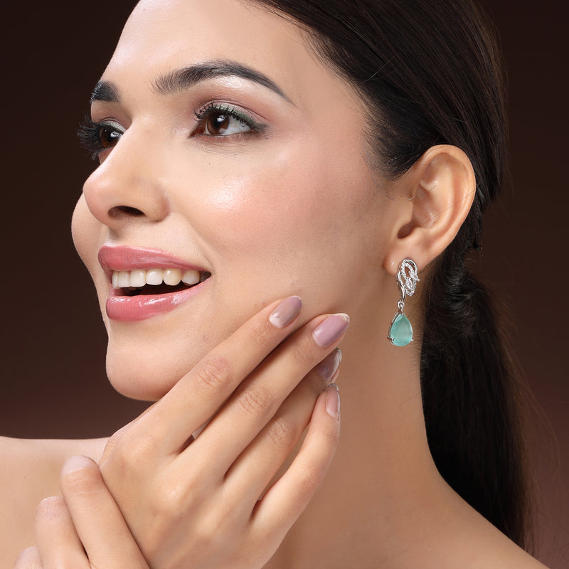 Rhodium Plated Silver Toned Teardrop Shaped Sea Green & White American Diamond Studded Drop Earrings