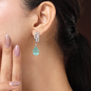 Rhodium Plated Silver Toned Teardrop Shaped Sea Green & White American Diamond Studded Drop Earrings