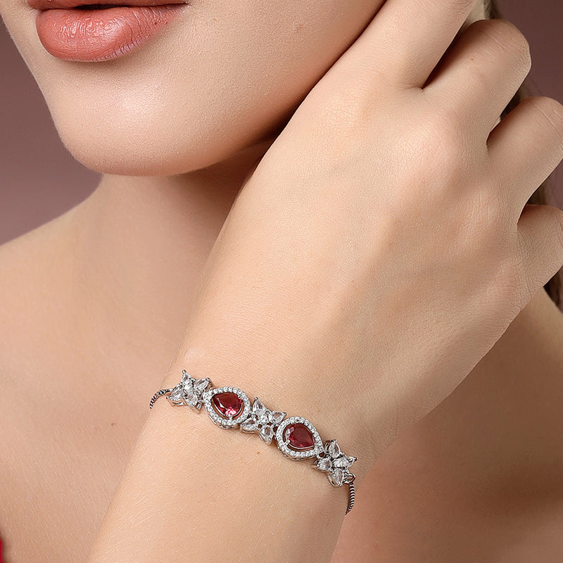 Rhodium Plated Silver Toned White Flower & Red Teardrop AD Studded Wraparound Adjustable Bracelet