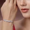 Rhodium Plated Silver Toned White Round &  Square Cut AD Studded Wraparound Adjustable Bracelet