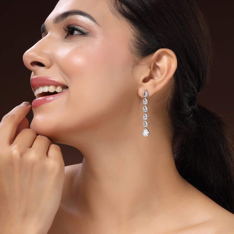 Rhodium Plated Silver Toned Teardrop Shaped White American Diamond Studded Linear Dangler Earrings