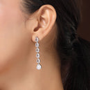 Rhodium Plated Silver Toned Teardrop Shaped White American Diamond Studded Linear Dangler Earrings