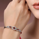 Rhodium Plated Silver Toned Oval & Teardrop Red American Diamond Studded Cuff Bracelet