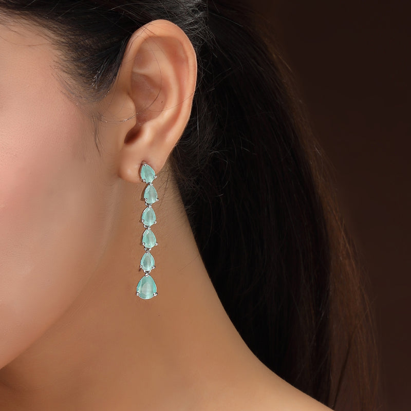 Rhodium Plated Silver Toned Teardrop Shaped Sea Green American Diamond Studded Linear Dangler Earrings