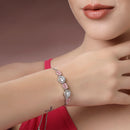 Rhodium Plated Silver Toned White Round & Pink Oval American Diamond Studded Wraparound Adjustable Bracelet