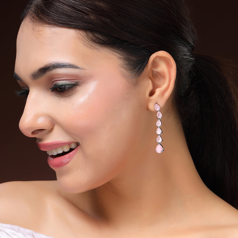 Rhodium Plated Silver Toned Teardrop Shaped Pink American Diamond Studded Linear Dangler Earrings