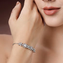 Rhodium Plated Silver Toned White Flower & Teardrop American Diamond Studded Wraparound Adjustable Bracelet