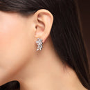 Rhodium Plated Silver Toned Floral Shaped White American Diamond Studded Stud Earrings
