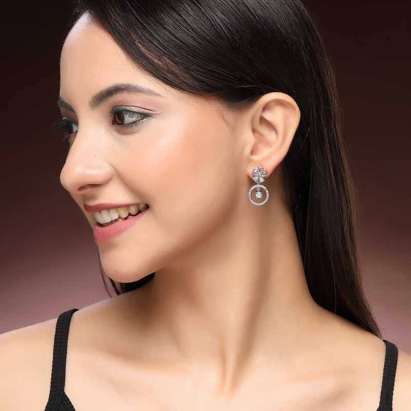 Rhodium Plated Silver Toned Floral Shaped Sea Green White American Diamond Studded Drop Earrings