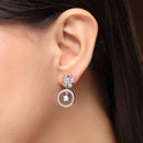 Rhodium Plated Silver Toned Floral Shaped White American Diamond Studded Drop Earrings