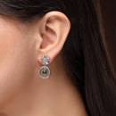 Rhodium Plated Silver Toned Floral Shaped Green & White American Diamond Studded Drop Earrings