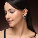 Rhodium Plated Silver Toned Floral Shaped Navy Blue & White American Diamond Studded Stud Earrings