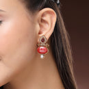 Traditional Gold Plated Oval Shaped Red Stone And Pearl Studded Earrings