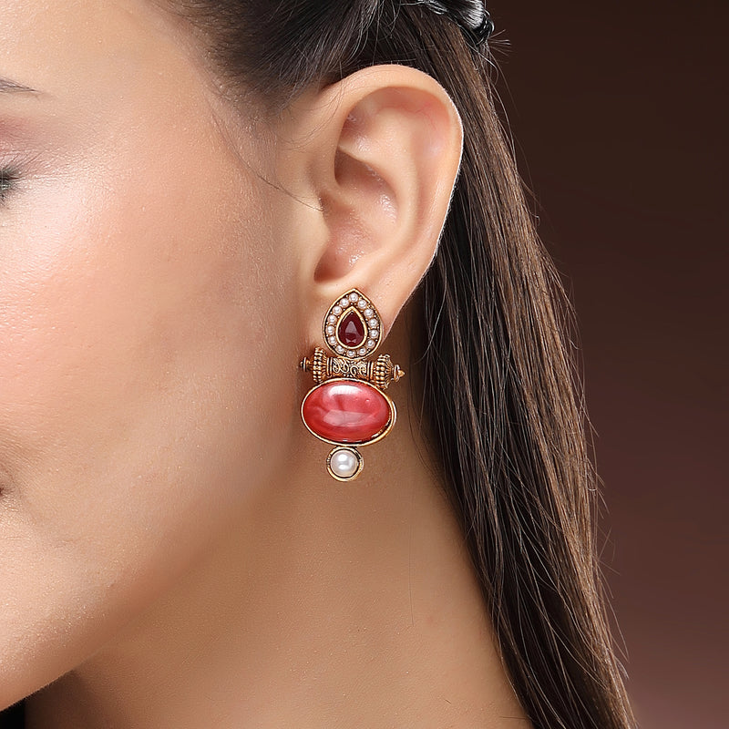 Traditional Gold Plated Oval Shaped Red Stone And Pearl Studded Earrings