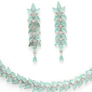 Rhodium Plated Silver Toned Sea Green Floral American Diamond Studded Necklace With Matching Earrings