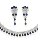 Rhodium Plated Silver Toned Blue American Diamond  Studded Classic Necklace With Floral Drop Earrings