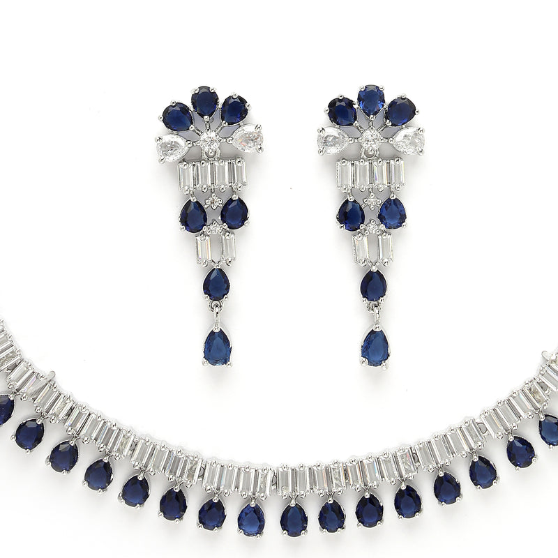 Rhodium Plated Silver Toned Blue American Diamond  Studded Classic Necklace With Floral Drop Earrings