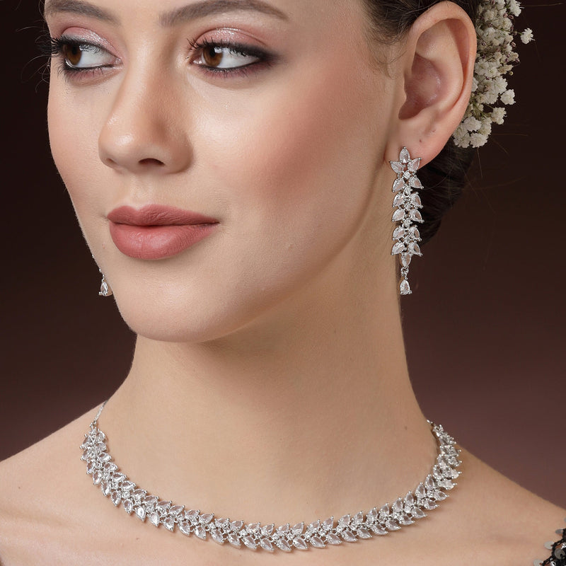 Rhodium Plated Silver Toned White Floral American Diamond Studded Necklace With Matching Earrings