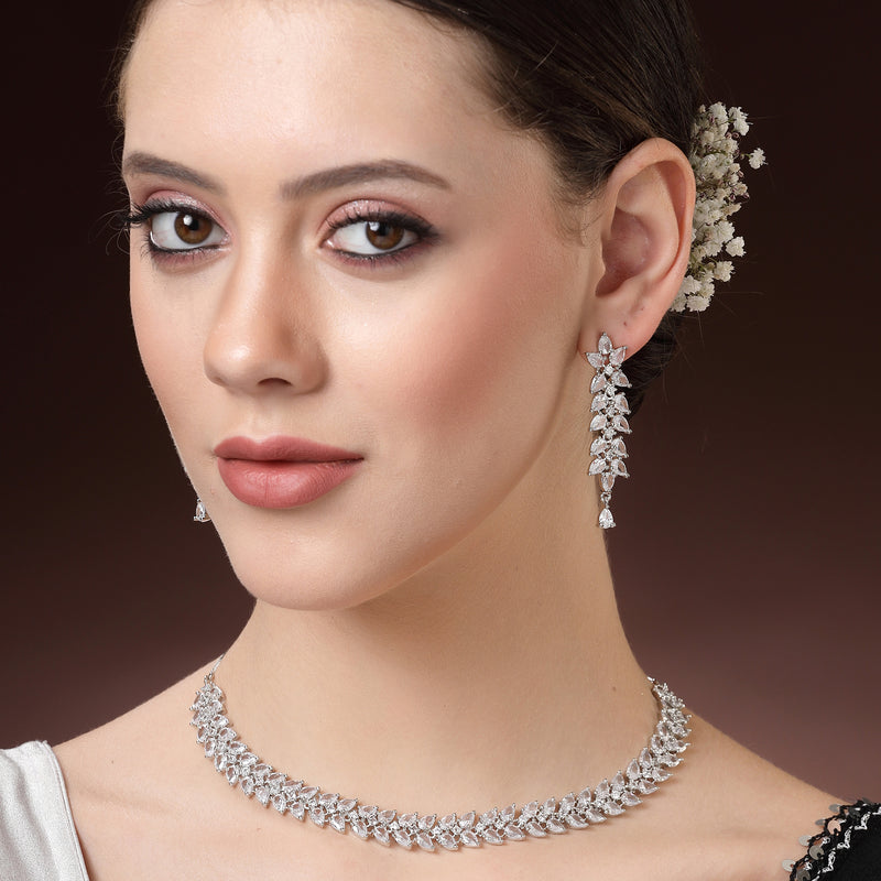 Rhodium Plated Silver Toned White Floral American Diamond Studded Necklace With Matching Earrings