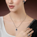 Rhodium Plated Silver Toned Oval Shaped Violet American Diamond Studded Pendant Combo With Ring