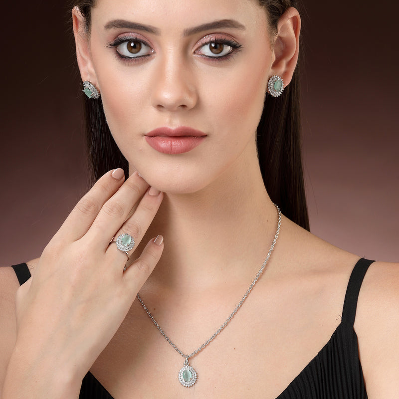Rhodium Plated Silver Toned Oval Shaped Sea Blue American Diamond Studded Pendant Combo With Ring