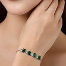 Rhodium Plated Silver Toned White Round & Green Square Cut AD Studded Wraparound Adjustable Bracelet